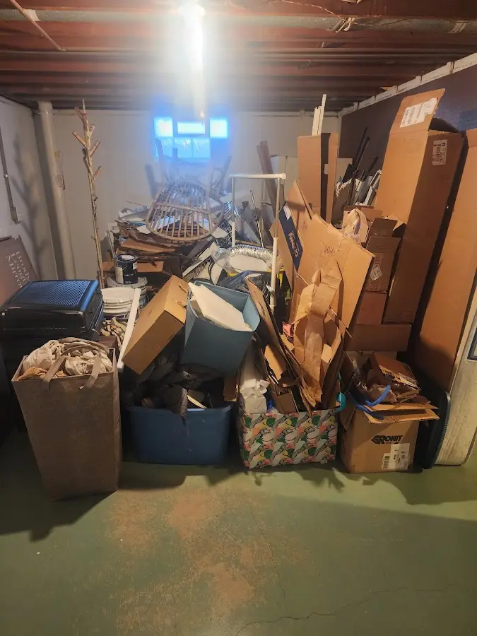 Roll-off dumpster container at job site for 2 Yard Dumpster Rental in Sandstone